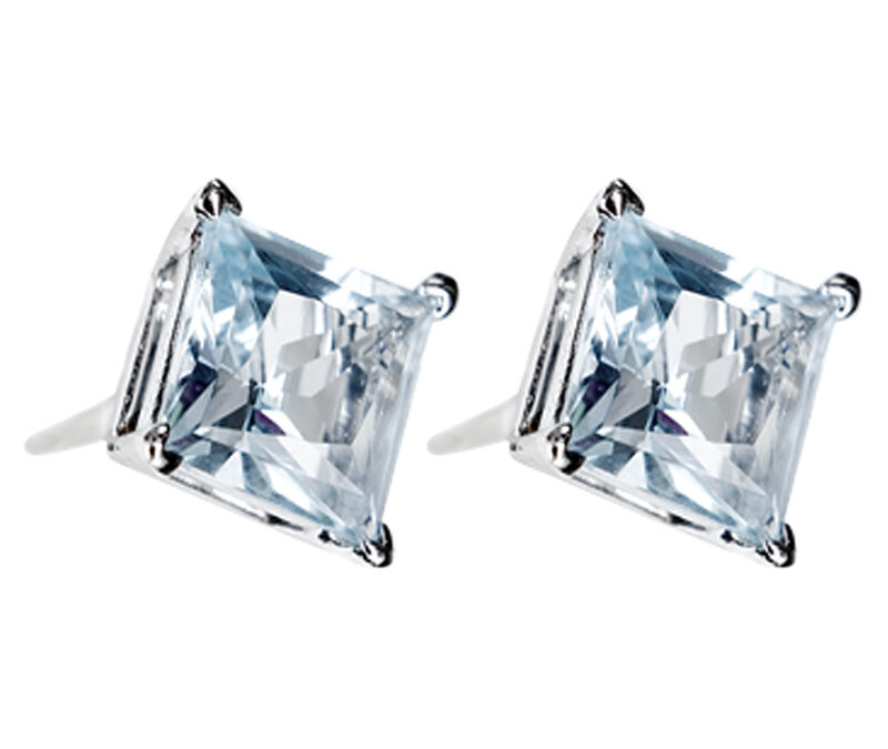 Princess cut blue topaz studs in 18k white gold. 6mm wide.